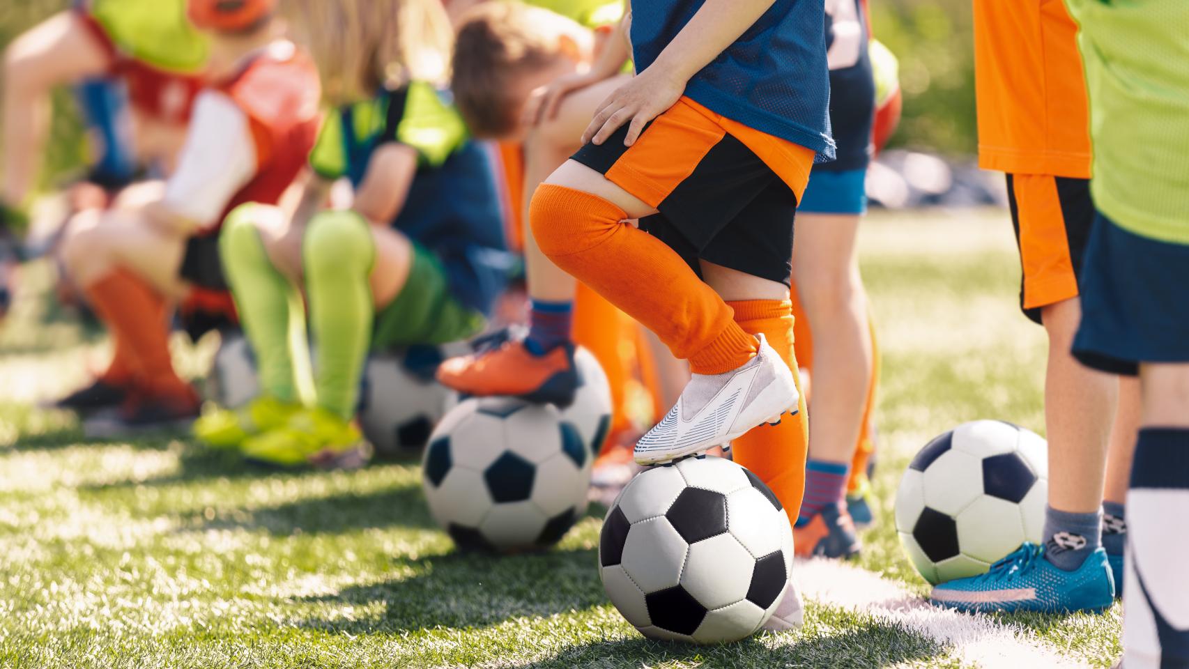 child legs with a ball